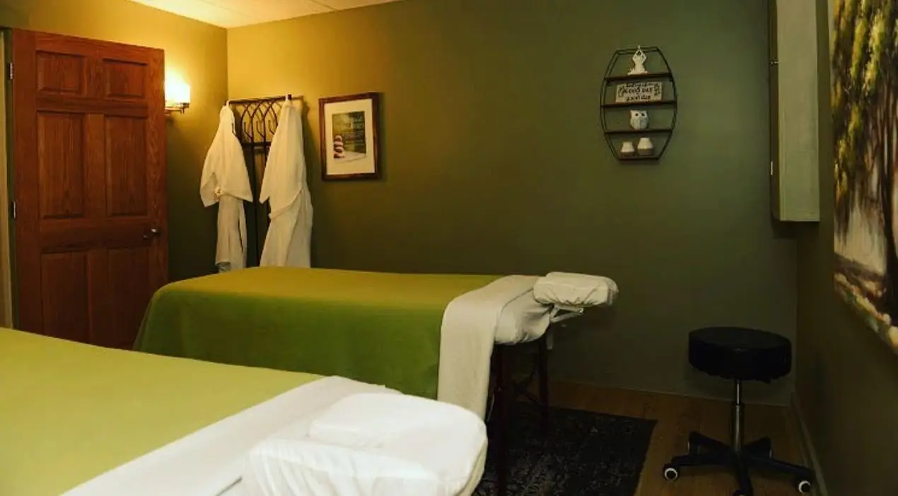 Couples therapy room with two massage tables at Well Being in Akron, Ohio